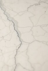 close up of a white marble surface with cracks