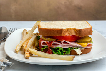 ham sandwich with a side of fries