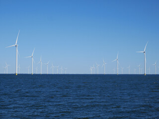 Windmills (Wind Turbines) at sea. Wind power plant at sea