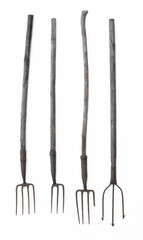 set of old rusty pitchforks isolated on white background