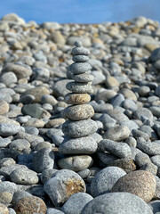 Stacked Pebble Stones at Moss Beach – Seventeen Mile Drive Coastal Zen Scene, California, USA. 