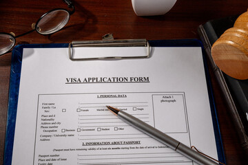 Visa Application Form in Clipboard on Desk – Immigration Document Scene