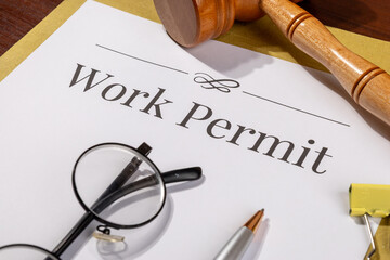 Work Permit Document on Desk Beside Gavel – Immigration Law Theme