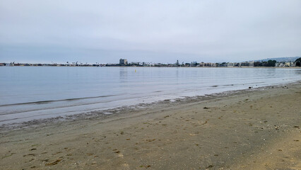 Crowded coastal strip of hotels, rental houses and boat marinas at Sail Bay on a summer overcast morning, San Diego, California