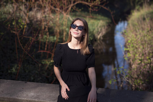 young woman in a black dress