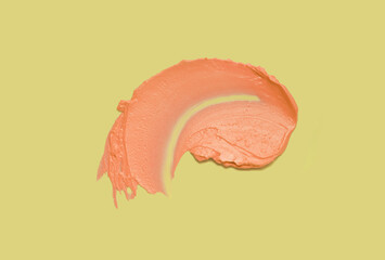 Orange pearl luminous lipstick swatch isolated on lime green background