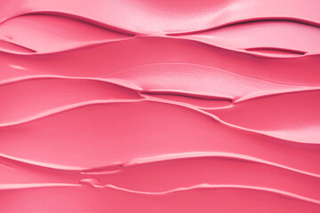 Pink matte or satin finish smeared liquid creamy lipstick background texture nude blusher sample...