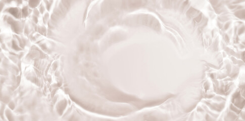 Soft focus lite brown yellow cosmetic moisturizer floral water, micellar toner, or emulsion abstract background. Reflections of  scattered sun texture.