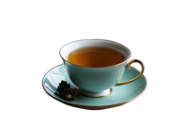 Teacup filled with tea on saucer with dark green object beside it, simple cozy setup, transparent PNG.