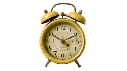 A detailed shot of a vintage, yellow alarm clock, set on a black background.