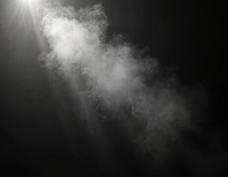 Abstract shot of steam, mist against black backdrop. White fog cloud floating. Misty, transparent spray. Fresh air with a soft light effect, creating a sense of beauty and freshness.