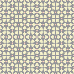 Flower petal seamless pattern vector. Polka dot floral motif tiled graphic in yellow and orange over gray.