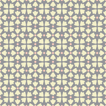 Flower petal seamless pattern vector. Polka dot floral motif tiled graphic in yellow and orange over gray.