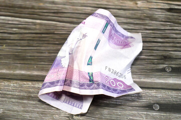 Crumpled 200 ETB two hundred Ethiopian Birr issued by the national Bank of Ethiopia, crushed wrinkled Ethiopian cash money banknote folded bill, inflation crisis, money value and exchange rate concept