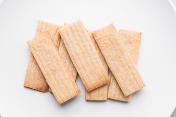 top view of stamped sugar cookies, Overhead view of cut out vanilla cookies on white background, process of making vanilla sugar cookies	