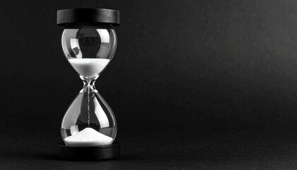 Modern hourglass on black background. Hourglass time concept for business deadline, urgency and outcome of time