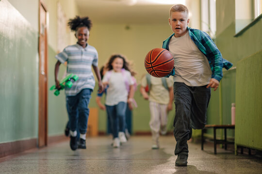 Students running in school hallway after class