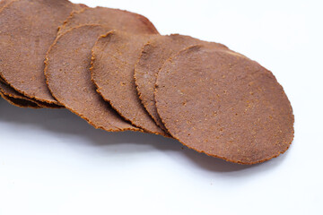 Fermented soybean discs, known as “Thua Nao,” a traditional Thai seasoning used to enhance flavor in Northern cuisine.