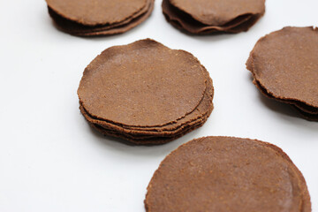 Fermented soybean discs, known as “Thua Nao,” a traditional Thai seasoning used to enhance flavor in Northern cuisine.