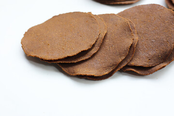 Fermented soybean discs, known as “Thua Nao,” a traditional Thai seasoning used to enhance flavor in Northern cuisine.
