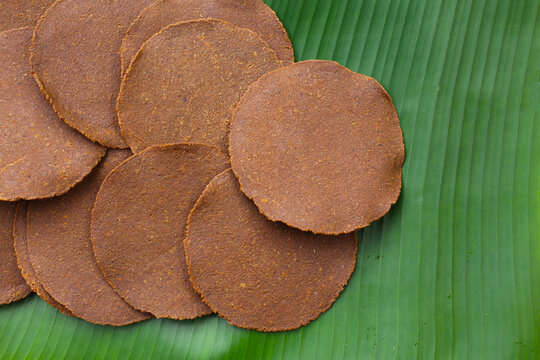 Fermented soybean discs, known as &ldquo;Thua Nao,&rdquo; a traditional Thai seasoning used to enhance flavor in Northern cuisine.