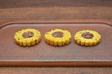 butter cookies placed on a tray on a wooden table
