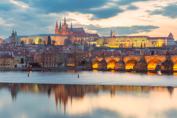 Sunset view of Vltava River with Charles Bridge and landmarks in Prague Czech Republic