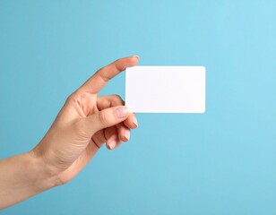 Close up female hand holds levitating template mockup Bank credit card with online service isolated on blue background