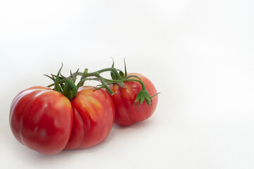 Red cherry tomatoes on a white background isolated on a white background