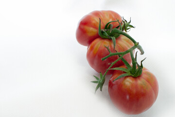 Red cherry tomatoes on a white background isolated on a white background