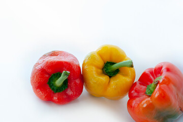Multicolored peppers isolated on white background. Photo of vegetables for banner.