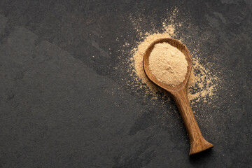 Organic Peruvian maca powder in spoon - Lepidium meyenii