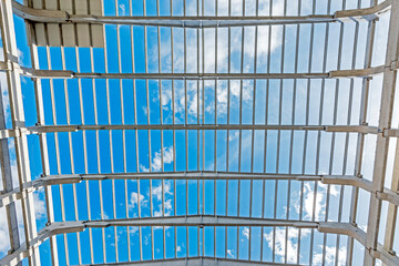 Interior view of the walls, supports, and roof of a precast commercial industrial prefabricated (precast) concrete. It is a construction product.