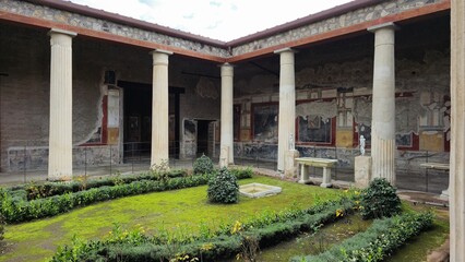 Pompeii, Italy – 8 January 2025. The smaller peristyle in the House of the Vettii includes a...
