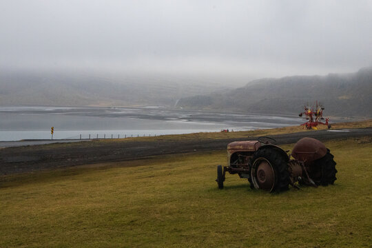 Fototapeta Farm tractor among an Icelandic scenery landscape