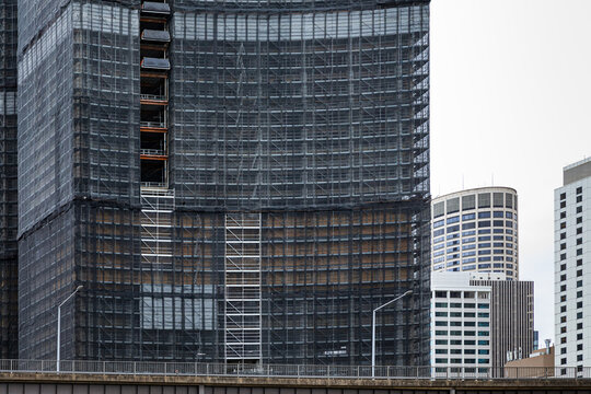 Construction site wrapped in scaffolding and mesh in Sydney