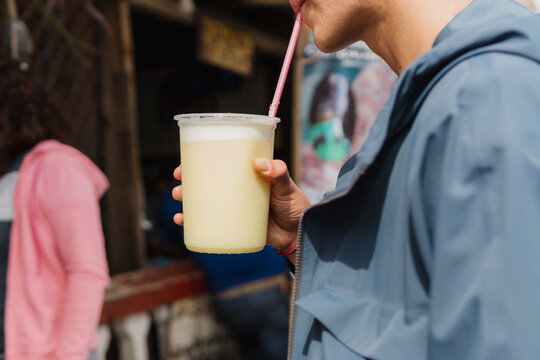 Person drinking cold beverage