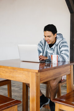 Content creator working on a laptop.
