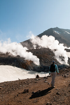 Hiker and thermal vents in Daisetsuzan National Park, Japan.