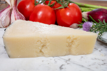 Pieces of matured pecorino romano italian cheese made from sheep milk in Lazio, Sardinia or Tuscany