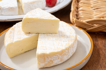 French soft cheeses collection, creamy cow's milk cheese le paysan and brie with white mold, France