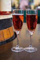 Pouring and tasting of rose or pink cuvee sparkling wine brut, grand reserve, champagne in Ay-Champagne wine making village in Vallee de la Marne, , Champagne region, France