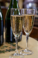 Pouring and tasting of dry sparkling wine brut, grand reserve, champagne in Ay-Champagne wine making village in Vallee de la Marne, , Champagne region, France