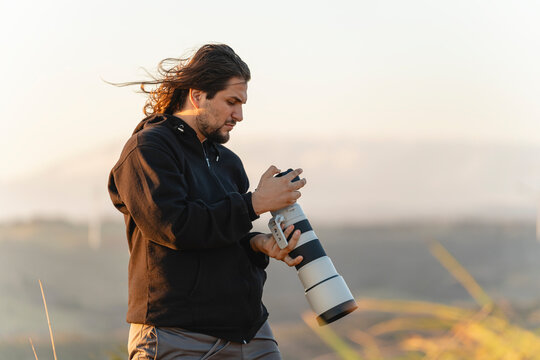 Photographer checking camera