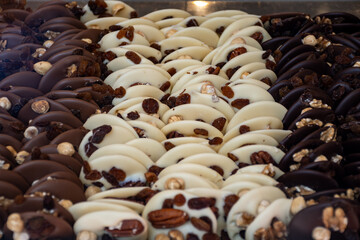 Obraz premium Famous Belgian chocolate candies on display in confectionery shop in Bruges, Belgium
