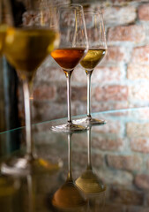 Visit of wine cellar, tasting of brut champagne sparkling wine produced by traditional method in underground caves close up