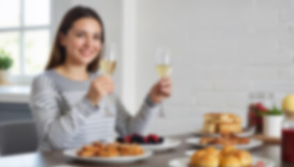 Blurred woman sits at breakfast table holding drinks. Image is intentionally blurred for background or design use.
