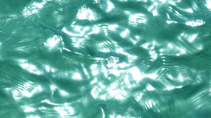 The blue tranquil beauty of the tropical waters is revealed, with sunlight dancing on the surface,...