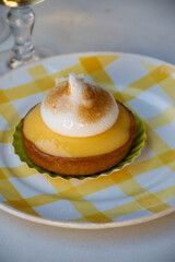 One piece of lemon tart with white eggs meringue from French pastry shop