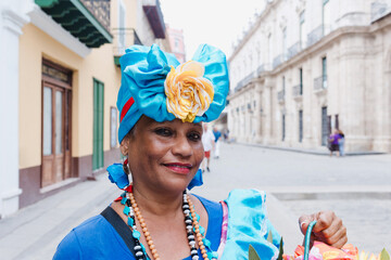 Cuban woman called canasteras with habano flowers and typical costume in La Havana, Afro caribbean...